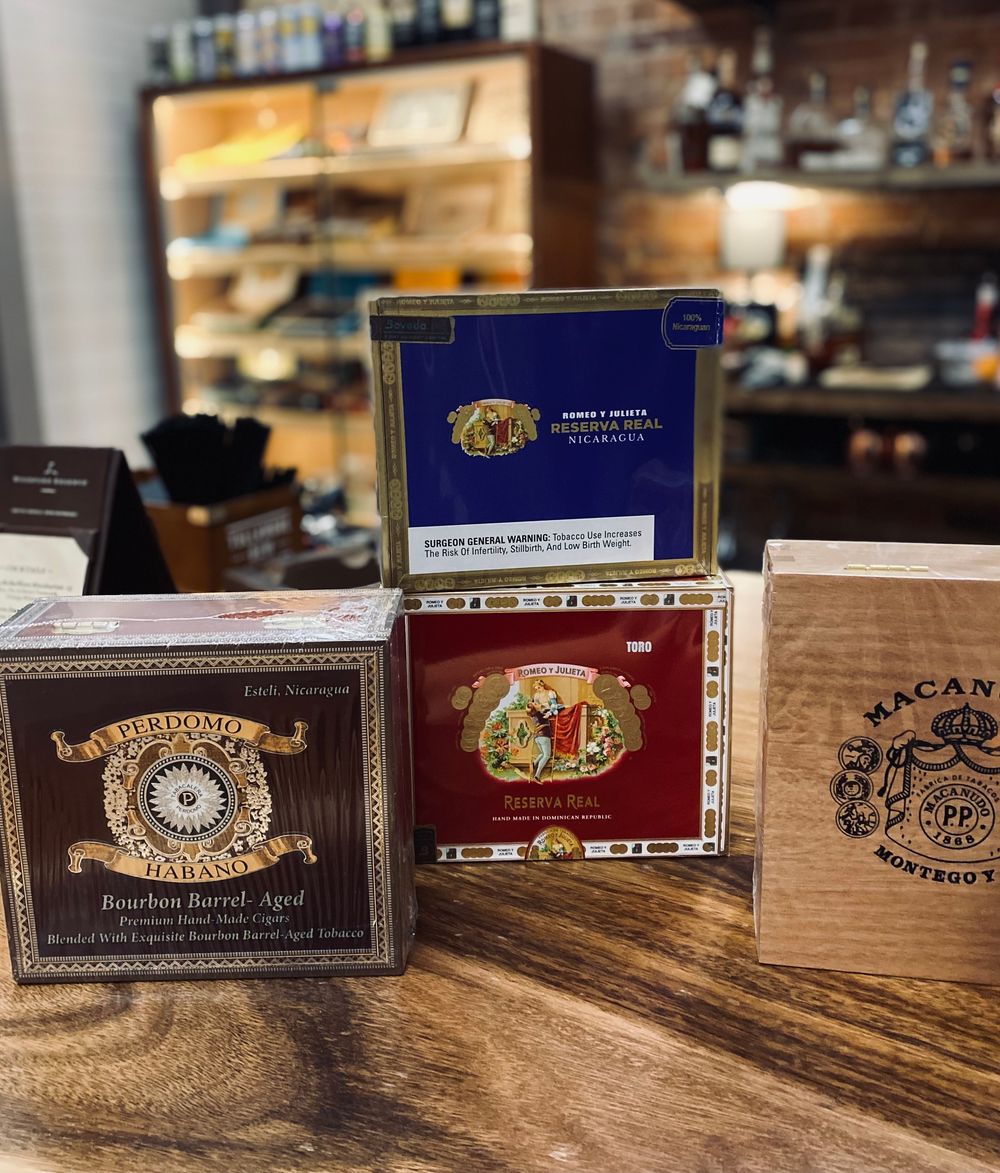 Cigar and whiskey on a wooden table
