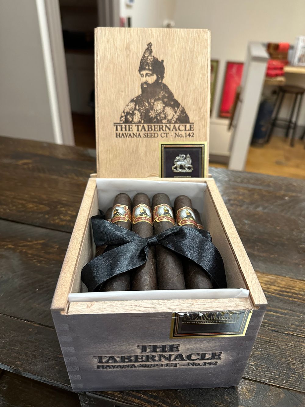 Cigar and whiskey on a wooden table