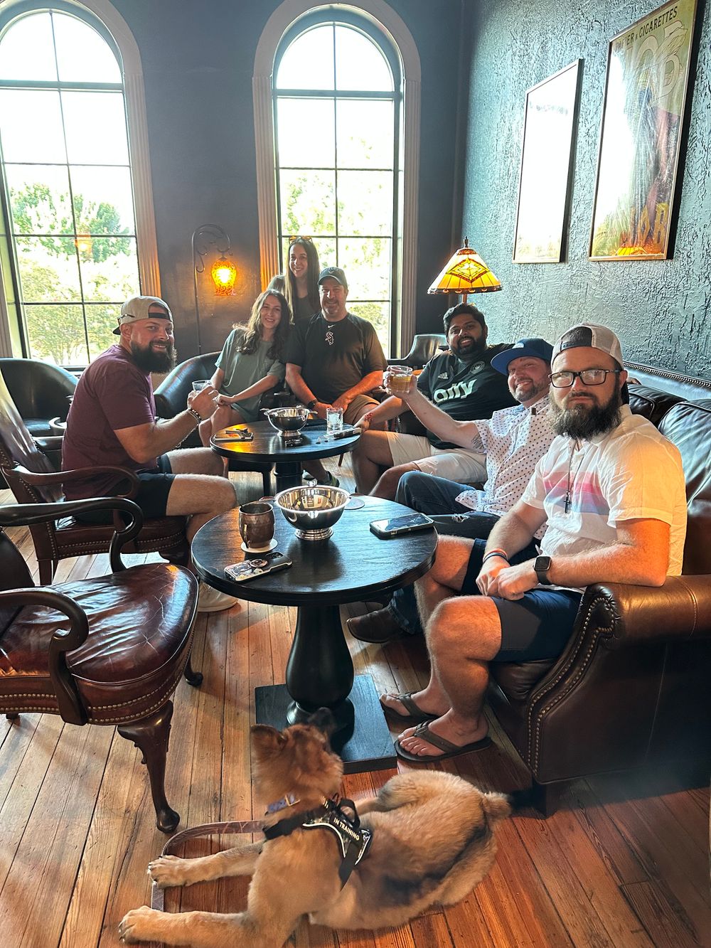 Group of people enjoying cigars