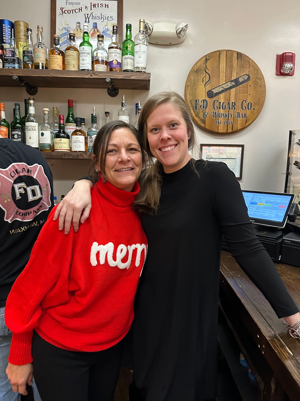 Friends laughing and enjoying cigars