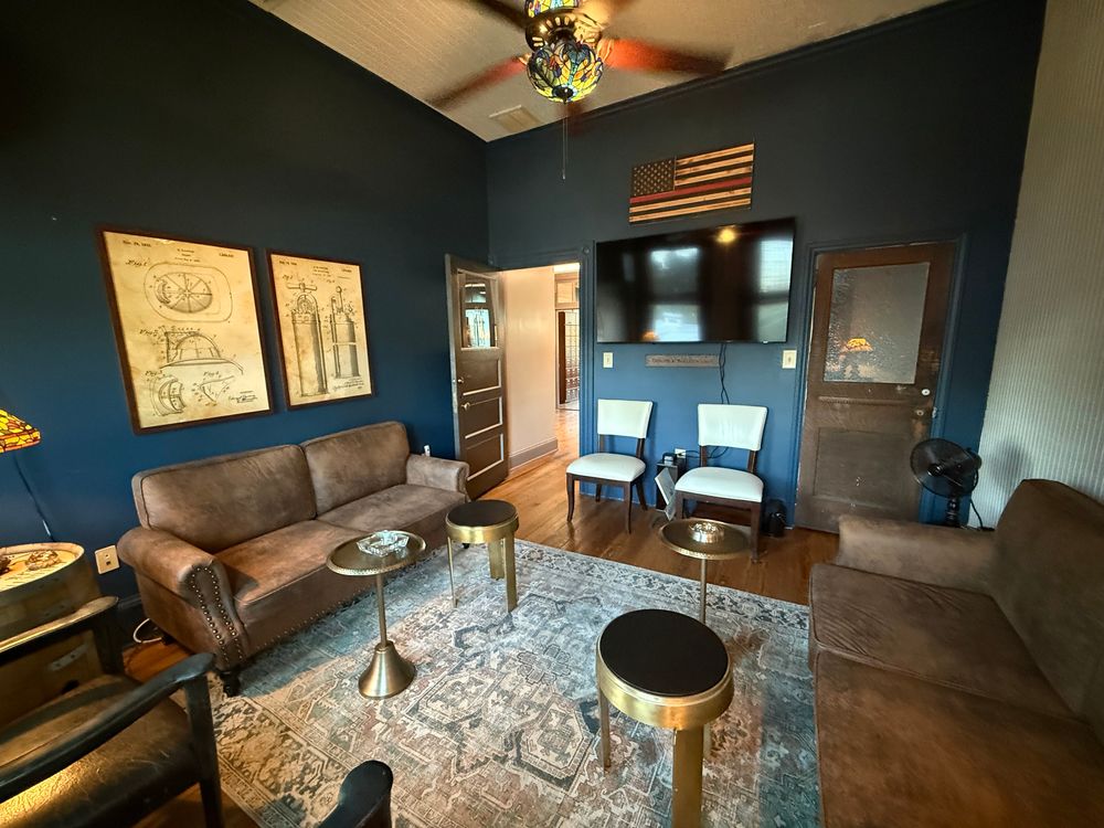 Chief's Private Lounge featuring comfortable leather seating and intimate lighting