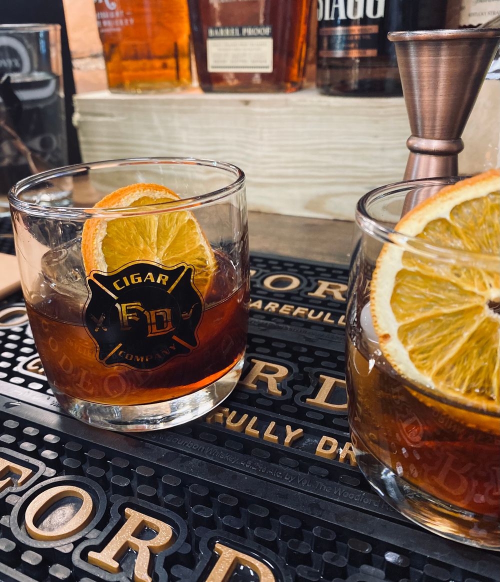 Cigar and whiskey on a wooden table